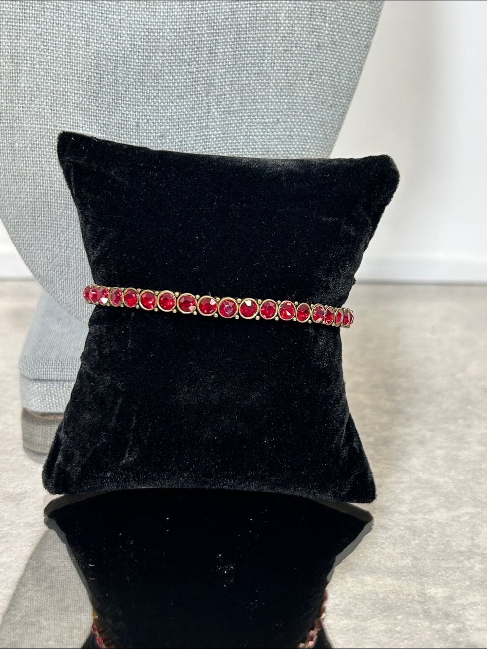Nina Ricci Brass Tennis Bracelet with Red Gemstones